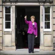 Nicola Sturgeon gives a thumbs-up on the steps of Bute House after the 2021 election result
