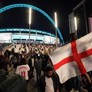England fans celebrate outside Wembley Stadium after England qualified for the Euro 2020 final