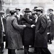 John Maclean (centre) shakes hands with David Kirkwood (left)