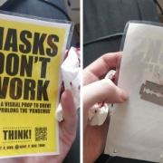 The woman was injured taking down anti-mask posters in Cardiff that had razors glued to the back of them