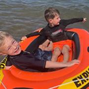 Nathan Gallagher and friend Findlay Keenan on the dinghy