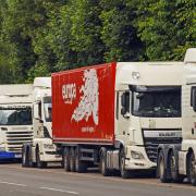 HGV lorries in a lay-by. The Road Haulage Association suggests delivery problems may worsen before Christmas.