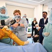 First Minister Nicola Sturgeon visited the Golden Jubilee Hospital as cash for the NHS recovery efforts was revealed