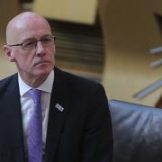 John Swinney has told MSPs the government is no longer seeking to suppress Covid to its lowest levels