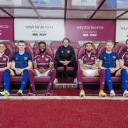 Hearts boss Robbie Neilson and his players modelled their Waystar gear