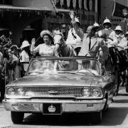 18th February 1966:  The Queen and Prince Philip driving through Barbados waving to the crowds.  (Photo by Keystone/Getty Images).