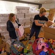Jackie Crawford, left, has seen thousands of people around the country flock to donate preloved boxes