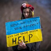 A woman at the Scotland Stands with Ukraine peace rally  outside the Scottish Parliament in March 2022
