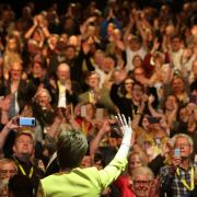 First Minister Nicola Sturgeon waves to delegates after her speech during the SNP spring conference at the EICC in Edinburgh in 2019