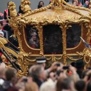A hologram of Queen Elizabeth in the Gold State Coach during the Platinum Jubilee Pageant in front of Buckingham Palace