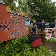 Activists at the entrance to the peace camp, from left: Wee Davy, Shrike and Stu Bretherton. Photo by Colin Mearns