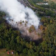 Scottish firefighters tackle a blaze in a woodland in 2022