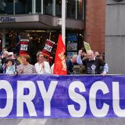 The banner stating 'Tory Scum Out' has drawn widespread criticism