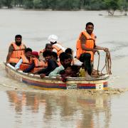 Army troops evacuate people from a flood-hit area in Rajanpur, district of Punjab, Pakistan