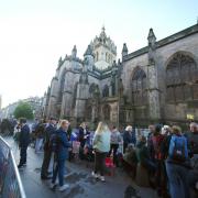 John Knox is buried at St Giles', Edinburgh, where people have gathered for the Queen's funeral cortege