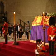 A royal guard collapsed next to the Queen's coffin