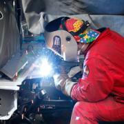 A welder working on one of the modified cars at Allied Vehicles on Balmore Road