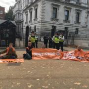 Scottish activists with the Just Stop Oil coalition glued themselves outside Downing Street on Wednesday