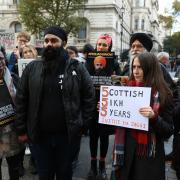 Gurpreet Singh Johal (front) with other protesters calling for the UK Government to help free his brother