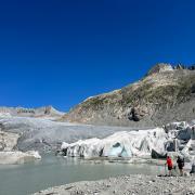 Dr Simon Cook and a colleague observe the rapidly retreating glacier in Rhone, Switzerland this summer