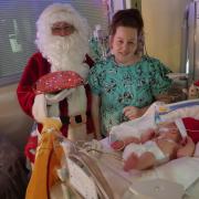 Dana, baby Auley James, and Santa photographed for the Children’s Hospices Across Scotland (CHAS) 2022 Christmas appeal