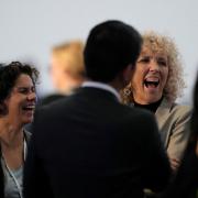 Maisa Rojas, minister of environment of Chile, left, and Germany’s climate envoy Jennifer Morgan laugh ahead of a closing plenary session at COP27
