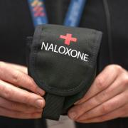 The Scottish Government said all community pharmacies will now hold two Naloxone kits