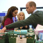 Kate and William helped pack food supplies and check labels on a visit to a Windsor food bank