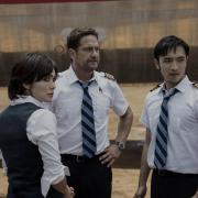 Gerard Butler as Brodie Torrance and Yoson An as Samuel Dele in Plane