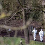 Police forensics officers at the scene in Culcheth Linear Park