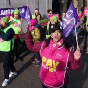 Teachers from the Educational Institute of Scotland (EIS) union take part in a rally outside the Tramway in Glasgow
