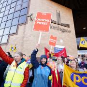 Members of the PCS union on the picket line outside the Passport Office in Glasgow.