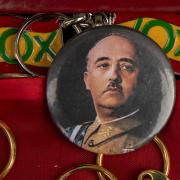 Souvenir with a picture depicting Franco is for sale next to keychains of far right wing VOX party