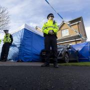 Officers from Police Scotland outside the home of former chief executive of the Scottish National Party (SNP) Peter Murrell, in Uddingston, Glasgow, after he was 