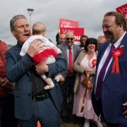 Labour leader Sir Keir Starmer holds five month old Hazel as he joins party members in Chatham, Kent, where Labour has taken overall control of Medway Council for the first time since 1998