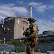 A Russian serviceman guards an area of the Zaporizhzhia nuclear power station.