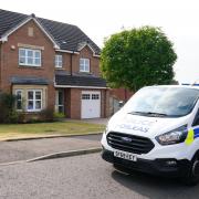 A Police Scotland van parked outside Nicola Sturgeon's home in Uddingston