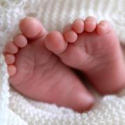 A newborn baby’s feet