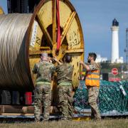 Specialist equipment being loaded onto a Royal Air Force A400M Atlas aircraft at RAF Lossiemouth, ahead of its trip to St John's in Canada to assist with the hunt for the Titan submersible