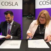 First Minister Humza Yousaf and the Cosla President, Shona Morrison, sign a landmark partnership agreement