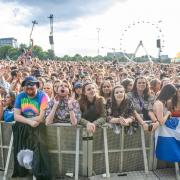 Festival goers watch George Ezra performing on the main stage at the TRNSMT Festival at Glasgow Green in Glasgow