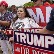Supporters of Former President Donald Trump gather at the E. Barrett Prettyman U.S. Federal Courthouse, Thursday, Aug. 3, 2023, in Washington.