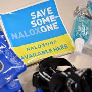 Naloxone nasal spray stickers on display. The drug can be used to save lives by reversing the effects of an opioid overdose
