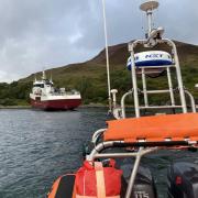 Kyle RNLI lifeboat approaching a 500-tonne vessel that ran aground