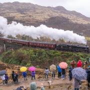 People come in their droves to catch a glimpse of The Jacobite train crossing the Glenfinnan viaduct