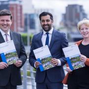 From left: SNP ministers Jamie Hepburn, Humza Yousaf, and Shona Robison with a paper on independence