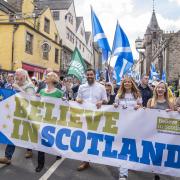 Humza Yousaf (centre) takes part in a Believe in Scotland event in Edinburgh