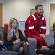 The Rig star Martin Compston with students on set