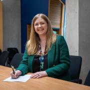 Gillian Mackay MSP signs her Safe Access Zones Bill ahead of it being lodged in the Scottish Parliament