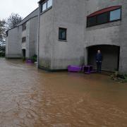 A man views flood water in Brechin